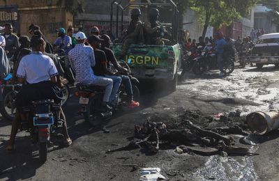 Gangs launch a new and deadly attack on Haiti's capital as dozens flee