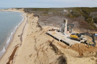 Luxury home at risk of tumbling into Cape Cod Bay over removal dispute is demolished