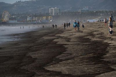 Wildfire debris washes up on LA beaches after major rainstorm