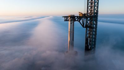 SpaceX rolls huge Super Heavy booster to pad ahead of Starship Flight 8 launch (photos)