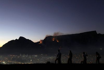 More than 100 firefighters battle blazes on South Africa's Table Mountain in Cape Town