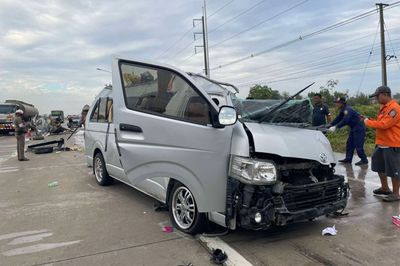 Four killed when van rear-ends truck