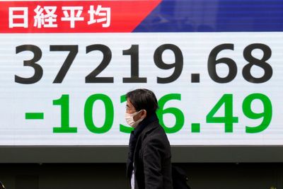 Stock market today: Asian shares skid, hit by AI doubts and Trump tariff hikes