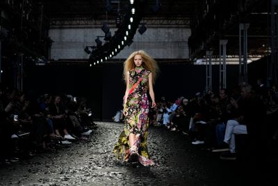 Moschino underlines playful collection with wake-up calls: Save our Sphere and Don't be Silent