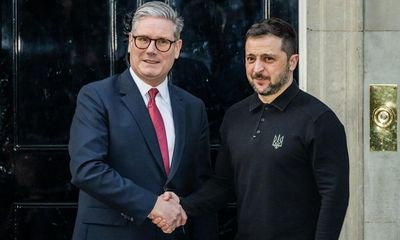 Eight injured after drone strikes apartment block in Kharkiv – as it happened