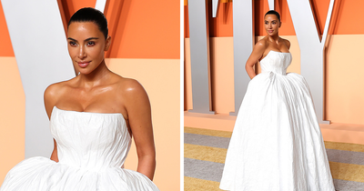 Kim Kardashian Brutally Roasted For “Toilet Paper” Dress And “Terrible Tan” At Oscars After Party