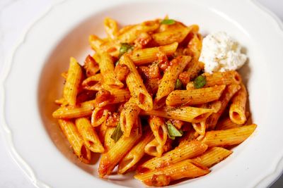 Salty pancetta and fermented pepper paste lend deep umami to this meaty pasta dish