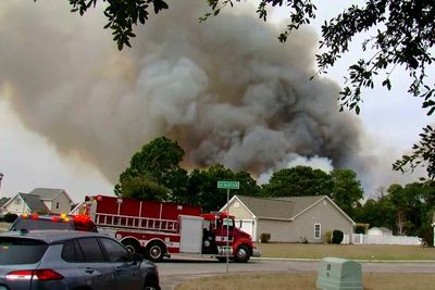 Lighter winds help crews fighting wildfires in South and North Carolina