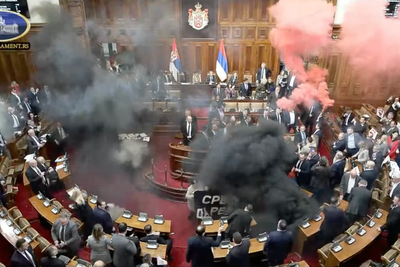 Watch: Three injured as parliament chaos sees smoke bombs thrown at politicians