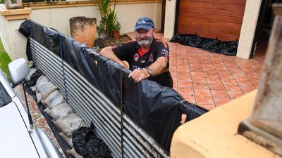 Sandbags to iron fences: millions braces for cyclone