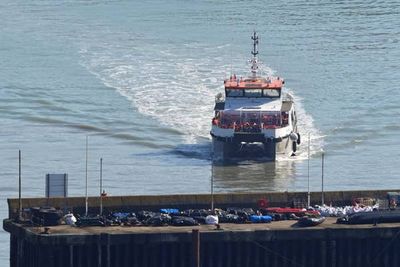 Migrants arrive in the UK after crossing English Channel