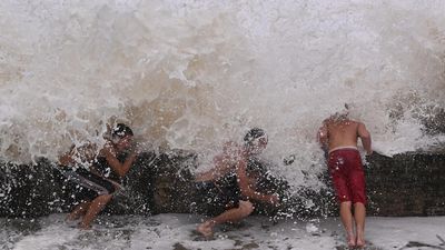 'Come already': millions bunker down ahead of cyclone