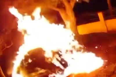 Moment arsonist sets himself on fire while torching car in gated California community