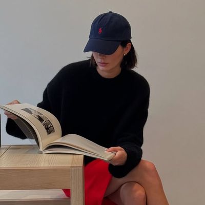 Kendall Jenner Dresses Like a Preppy Ralph Lauren Muse in a Cherry Red Skirt, Navy Dad Hat, and The Row Loafers