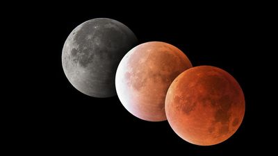 Why does the moon turn red during a total lunar eclipse?
