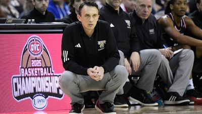 College Hoops Coach Cut Down Conference Tournament Net With Symbolic Pair of Scissors