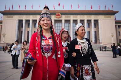 China's annual political meetings feature minority delegates in tribal finery with a message