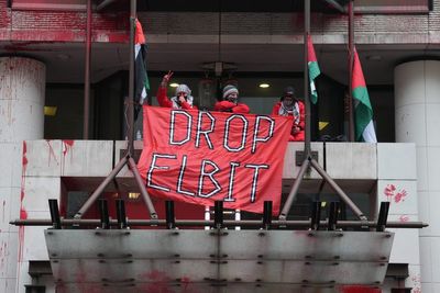 Pro-Palestine protesters spray red paint on insurance giant’s offices