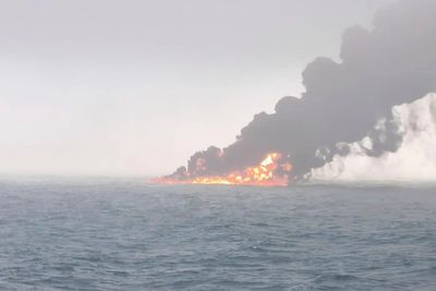 A cargo ship hits a tanker and they catch fire off England. The crew members are safe