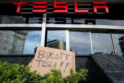 Trump says he's going to buy a Tesla as more Americans say they won't