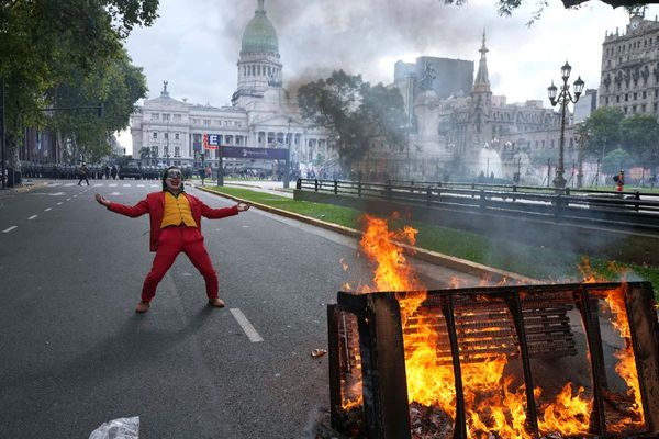 Argentine retirees and soccer fans clash with police during protests against austerity measures