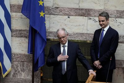 A veteran conservative lawmaker is sworn in as Greece’s new president