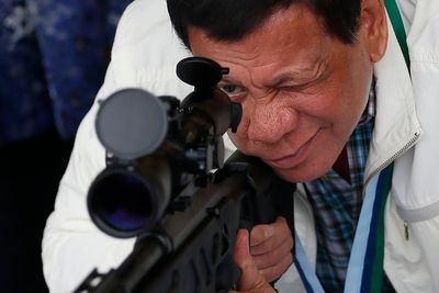 Duterte refused fingerprinting and threatened lawsuits during chaotic arrest, Philippine police say