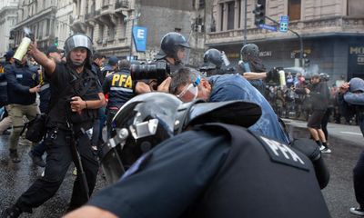 Photographer in coma after Argentina police hit pensioner protest hard