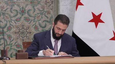 Syria’s al-Sharaa signs temporary constitution