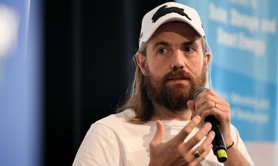 Billionaire climate campaigner Mike Cannon-Brookes defends buying private jet and sponsoring F1 team