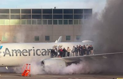 American Airlines: Moment plane engine bursts into flames forcing passengers onto wing