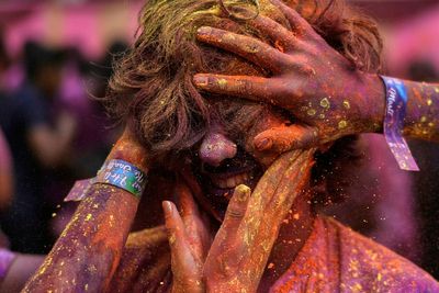 With a kaleidoscope of colors and music, the Hindu festival of Holi signals the arrival of spring