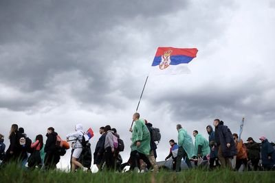 Thousands converging in Serbian capital for a major rally that tests the ruling populists