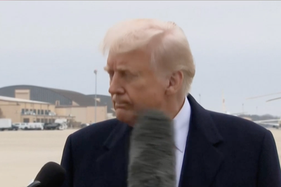 Donald Trump stares down reporter after microphone hits his face