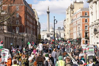 Palestine supporters march through central London