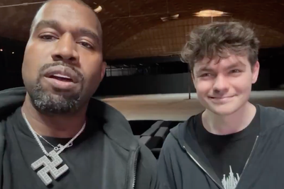 Kanye outrageously preens poses in a swastika chain with white supremacist Nick Fuentes