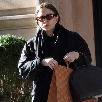 Ashley Olsen Pairs the Double Bag Trend With The Row's Polarizing $890 Flip Flops