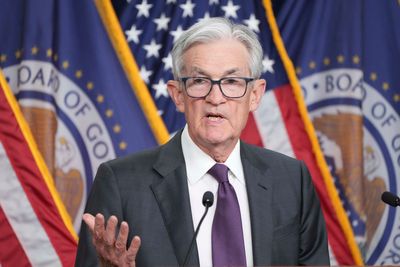 Federal Reserve keeps interest rate unchanged, sees slower growth, slightly higher inflation ahead