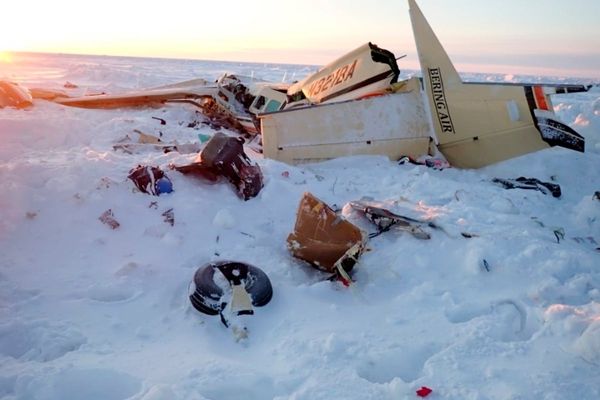 US investigators say Alaska plane was overweight for icy conditions in crash that killed 10