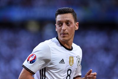 'We have agreed not to invite Mesut due to his recent actions' Ex Arsenal and Real Madrid star Mesut Ozil banned from former club due to right-wing tattoo