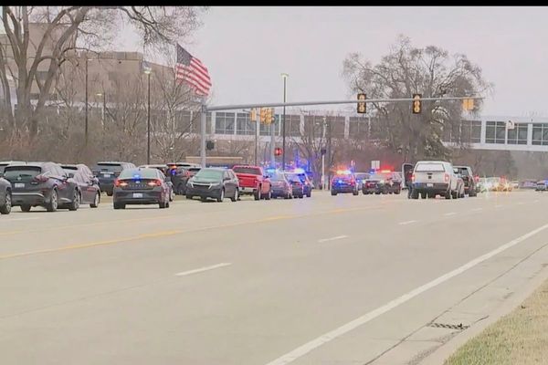 Police confirm a shooting at a Michigan hospital and say the suspect remains at large