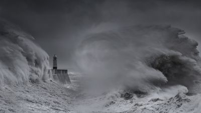 "The wind was ferocious and the sea spray was relentless, making it difficult to keep my lens clean," says photographer caught in one of Britain's wildest storms