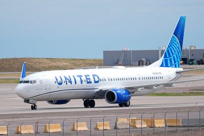 A flyer says a United Airlines pilot forcibly removed him from an airplane bathroom. Now he's suing
