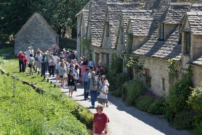 Pretty English village overrun by tourists weighs ban on coaches after angry clashes