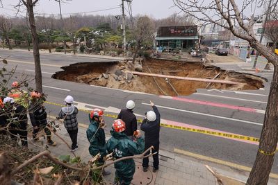 Motorcyclist who disappeared into huge Seoul sinkhole found dead