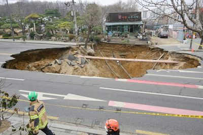 Motorcyclist Killed By Giant Seoul Sinkhole
