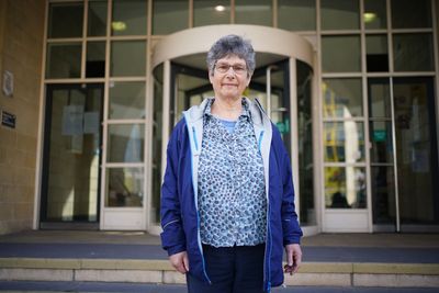 Retired GP who obstructed railway during power station protest avoids jail