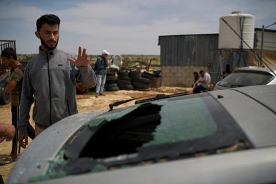 Wife of Oscar-winning Palestinian director says he was savagely beaten outside his home