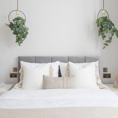 Are decorative cushions on a bed a must or a waste of time and money? Help us settle the debate