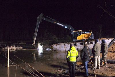 US and Lithuanian forces struggle to drain swamp to recover 4 soldiers in submerged armored vehicle